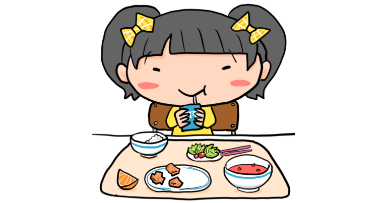 給食の牛乳を飲む女の子