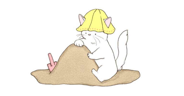 砂場で遊ぶネコ