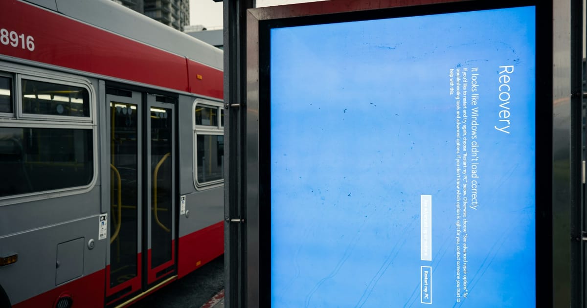 https://unsplash.com/photos/a-bus-stop-with-a-bus-parked-next-to-it-vKla95GgAwg